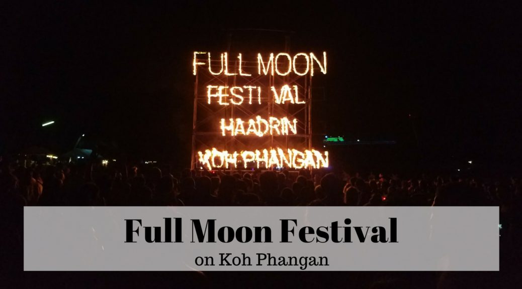 full moon festival on koh phangan lit up in firey letters