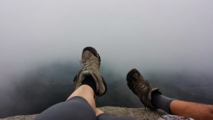 stuck in the clouds at the top of a hike on an active trip to conway, new hampshire