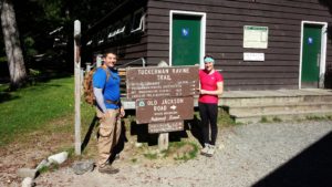 Standing at tuckerman ravine trail sign